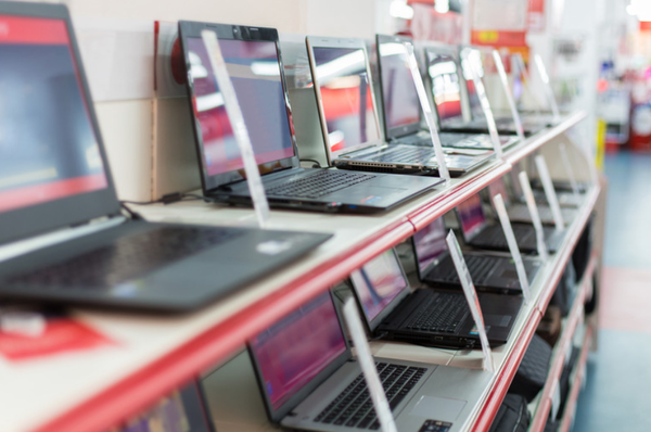 AI image of computer laptops on store shelves